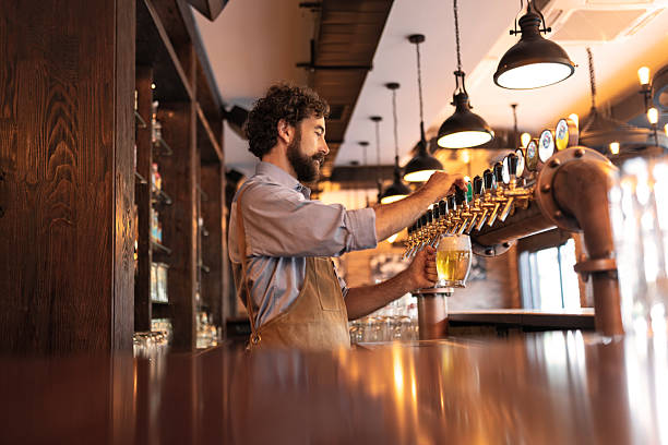 Bartender pouring a cold beer at Your Bar